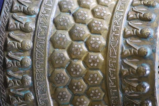 A 13th century Khorassan silver and copper inlaid bronze candlestick, 10.5in.
